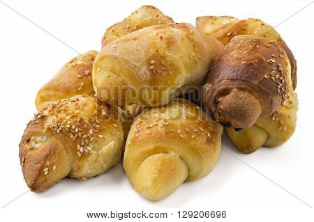 Fresh Serbian pastry rolls with cheese and sesame, kifla, kiflice, isolated on white background