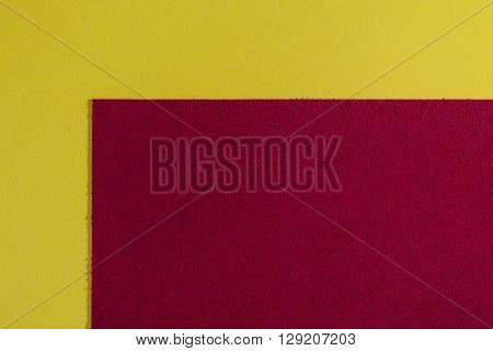Eva foam ethylene vinyl acetate sponge plush red surface on lemon yellow smooth background