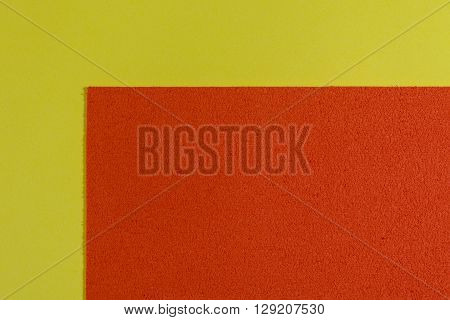 Eva foam ethylene vinyl acetate sponge plush orange surface on lemon yellow smooth background