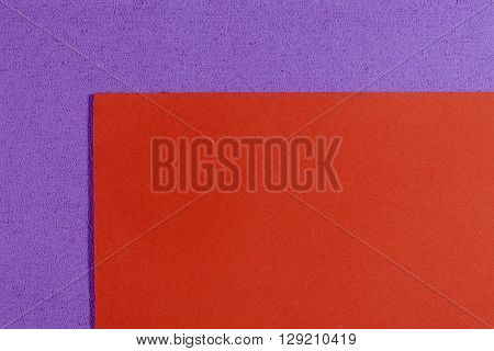 Eva foam ethylene vinyl acetate smooth orange surface on light purple sponge plush background