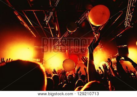 night party festival crowd of people silhouettes hands up