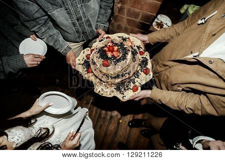 homemade rustic wedding cake with tasty berries