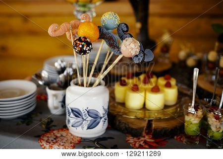 rustic catering service buffet table with delicious sweet food