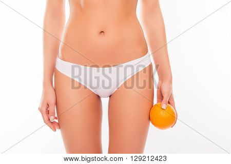 Close Up Portrait Of Sexy Woman Holding Orange Near Her Hip
