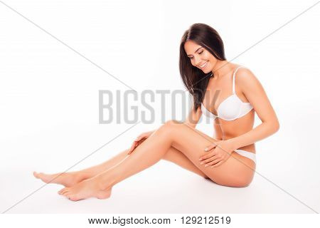 Beautiful Sensual Woman In White Underwear Doing Massage For Her Legs