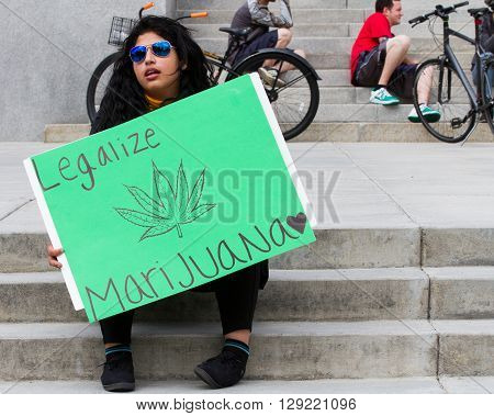 BOISE IDAHO/USA - MAY 7 2016: woman in proud support of making marijauan legal at the Global Marijuana march in Boise Idaho