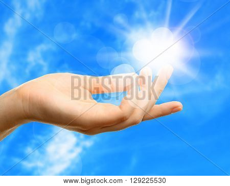 Female hand with sun