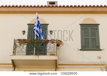 Traditional Building Balcony With Greek Flag In Plaka Area, Athens