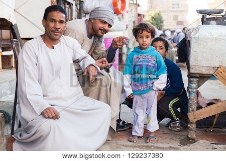 DARAW, EGYPT - FEBRUARY 6, 2016: Local family posing for camera at Daraw market.