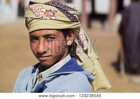 DARAW, EGYPT - FEBRUARY 6, 2016: Portrait of local boy with head scarf.