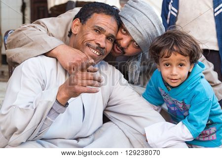 DARAW, EGYPT - FEBRUARY 6, 2016: Local family posing for camera at Daraw market.