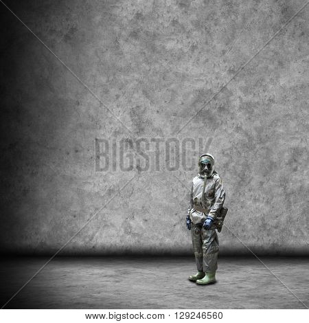 Soldier wearing a gas mask in disaster war and military concept