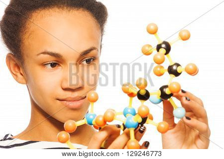 Close-up photo of African student, beautiful girl, holding molecular model, isolated on white background