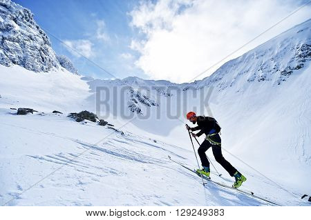 FAGARAS ROMANIA - MARCH 5: Ski mountaineer competes during the Ski Mountaineering National Competition in Fagaras Mountains Carpathian Range on March 5 2016 in Romania.
