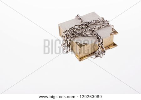 A chained book on a white background