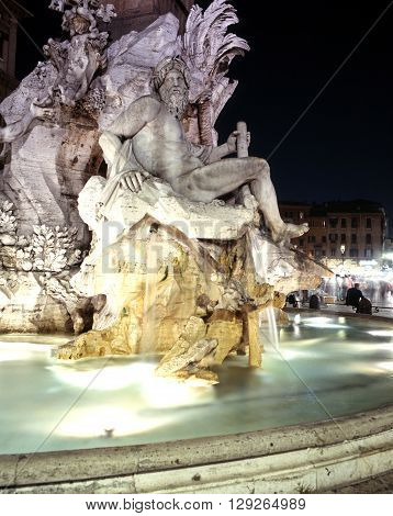 ITALY, ROME - SEPTEMBER 14, 1992 - Fontana dei Quattro Fiumi (Four Rivers fountain) in the Piazza Navona floodlit at night Rome Italy Europe, September 14, 1992.