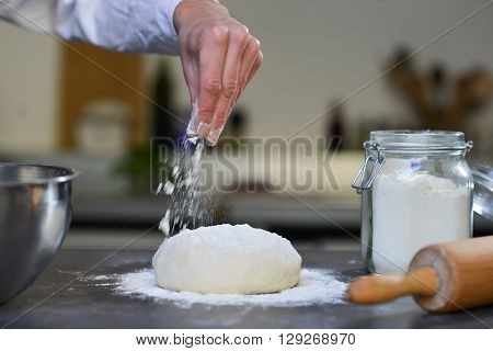 Chef preparing dough in kitchen flour douth Pizza