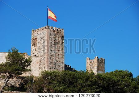 View of Sohail castle with a Spanish flag on one of the towers Fuengirola Malaga Province Andalucia Spain Western Europe.