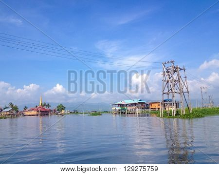 SHAN MYANMAR - MAY 26 : Traditional floating village houses in Inle Lake Myanmar on May 26 2014. Inle Lake is a freshwater lake located in the Nyaungshwe Township of Taunggyi District of Shan State part of Shan Hills in Myanmar.