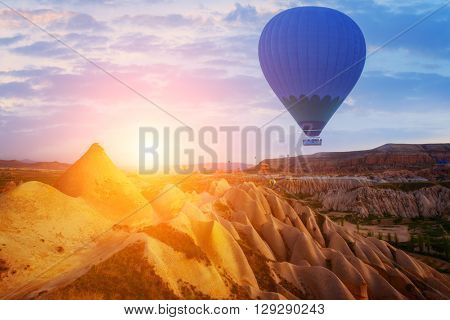 Balloon silhouette in the sunrise sky. Cappadocia, Turkey