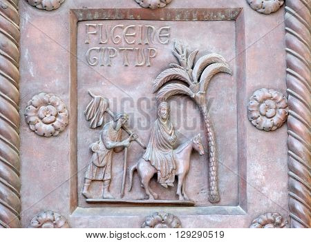 PISA, ITALY - JUNE 06, 2015: Flight to Egypt on the San Ranieri gate of the Cathedral St. Mary of the Assumption in Pisa, Italy on June 06, 2015