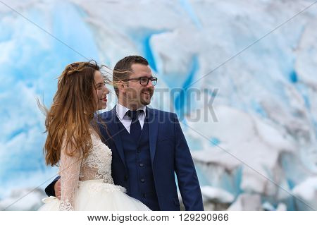Bride And Groom  Posing Near Glacier