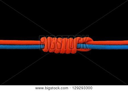 Knot on a cord on a dark background