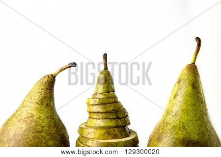 Three pears: one cutting and two whole on white bakground
