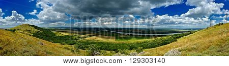 panoramic view of fields in spring and cloudy sky, Mahmudia, Romania
