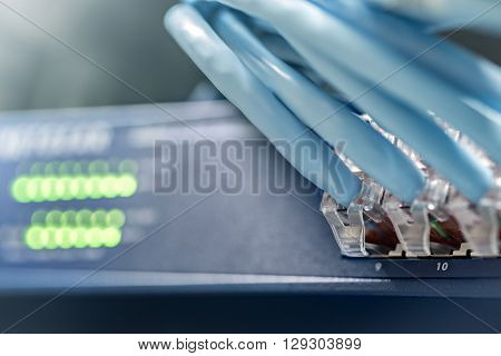 Gigabit switch with connected cables inside server rack