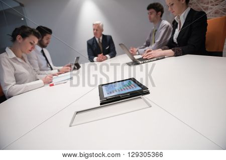 business people group brainstorming on meeting and businessman presenting ideas and projects oon laptop and tablet computer