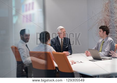 business people group brainstorming on meeting and businessman presenting ideas and projects oon laptop and tablet computer