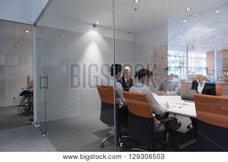 business people group brainstorming on meeting and businessman presenting ideas and projects oon laptop and tablet computer