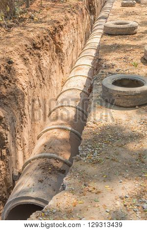 underground drainage concrete pipe in construction site selective focus