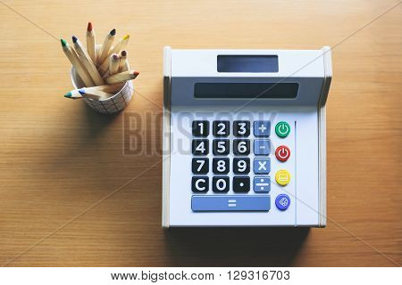 Calculator with color pencils on table Money saving Budget control Financial management Startup concept