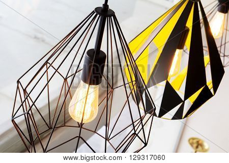 Edison's light bulb and lamp in modern style coffee shop. warm tone photo