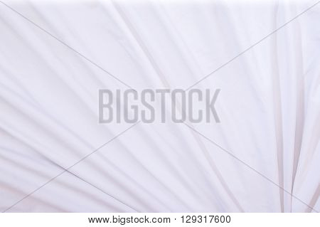 Top view of white bed sheets crease