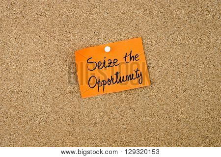 Seize The Opportunity Written On Orange Paper Note