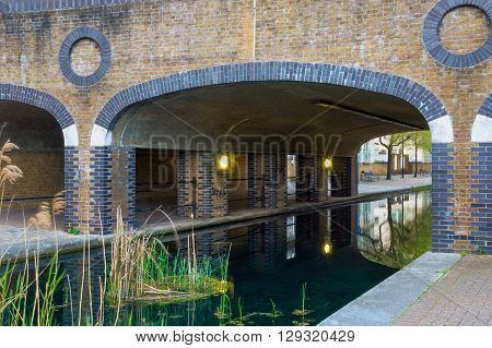 Albion Channel under a path bridge an ornamental canal created linking Canada Water to Surrey Water