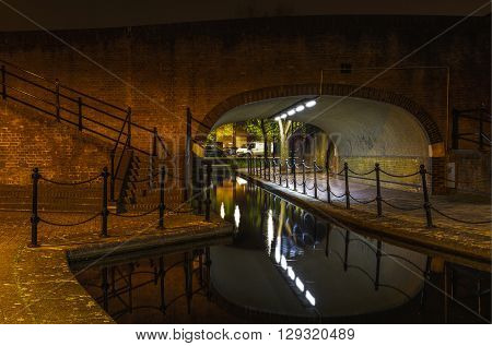 Albion Channel under a path bridge an ornamental canal created linking Canada Water to Surrey Water