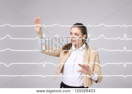 Doctor woman working with cardiogram lines
