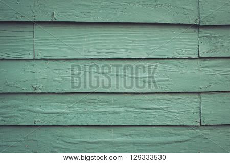 Wooden patterns on the wall in old wooden house Painted bright blue