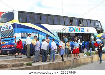 Cajamarca Peru - April 12 2016: Group of Peruvians waiting for long-distance bus to leave from Cajamarca Peru on April 12 2016