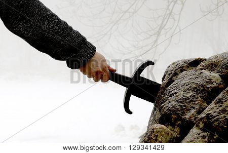 Knight Tries To Remove Excalibur Sword In The Stone