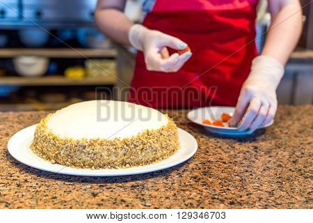 cooking homemade cake in restaurant with open kitchen