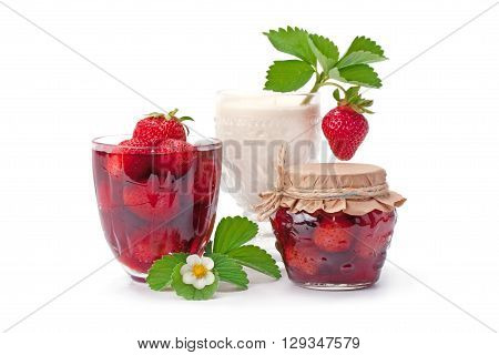 Strawberry jam and strawberries with cream isolated on white.