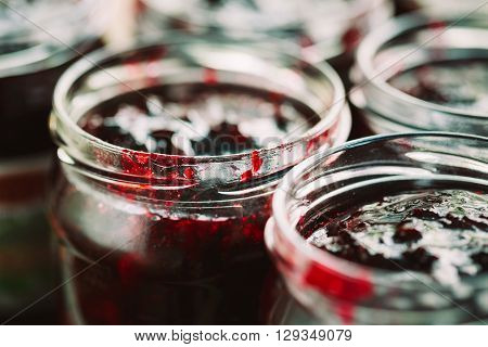 Close Up View Of Jars With Sweet Tasty Yummy Red Jam