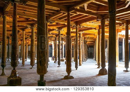 Khiva Uzbekistan - Aprilr 14 2014: The wood columns of the old Juma mosque inside