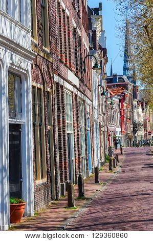 typical row houses along a canal in Gouda Netherlands