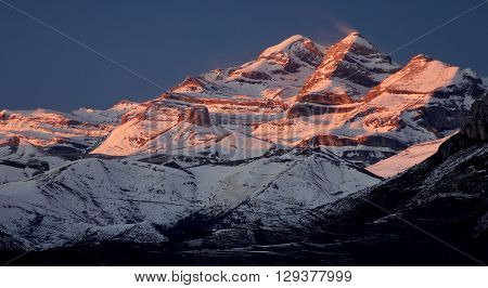 Sunset in snowy mountain, Ordesa National Park, Pyrenees, Huesca, Aragon, Spain.